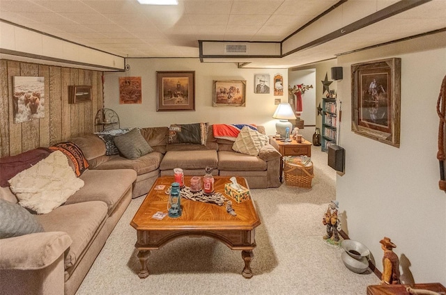 living room featuring carpet flooring and wooden walls