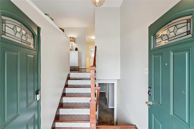 view of carpeted entrance foyer