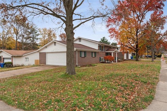 ranch-style home featuring a front lawn and a garage