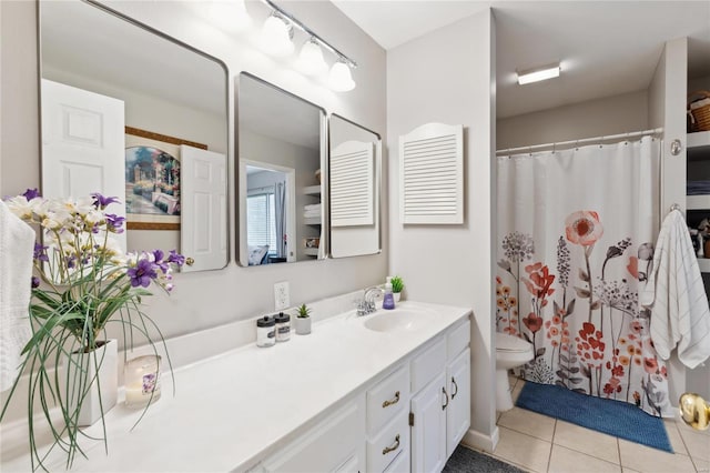 bathroom with tile patterned floors, vanity, and toilet