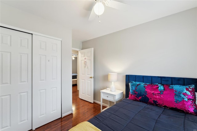 bedroom with ceiling fan, dark hardwood / wood-style flooring, and a closet