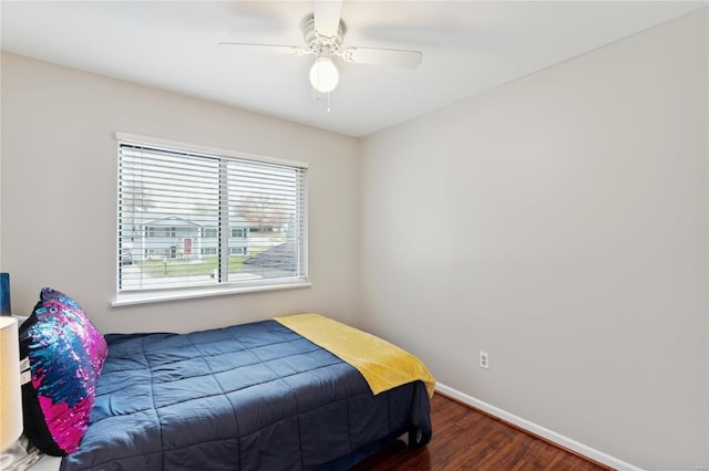 bedroom featuring ceiling fan and dark hardwood / wood-style floors