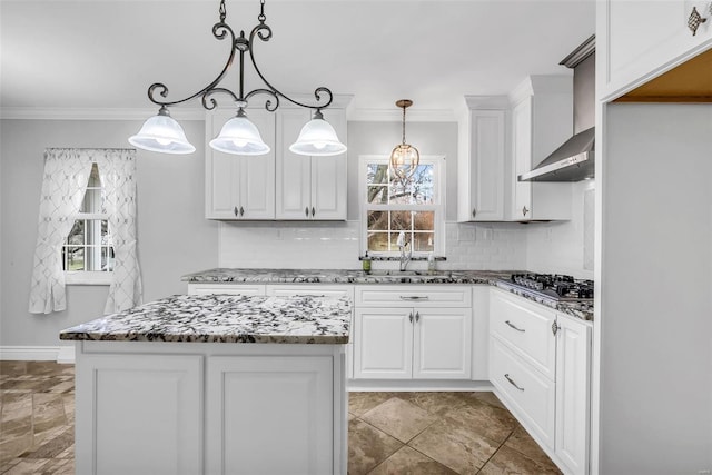 kitchen featuring pendant lighting, white cabinetry, and stainless steel gas cooktop