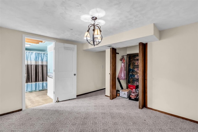 spare room featuring light colored carpet