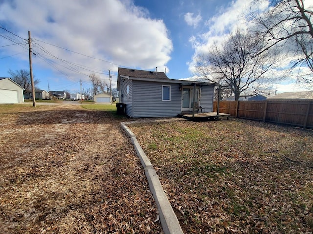 back of property with fence