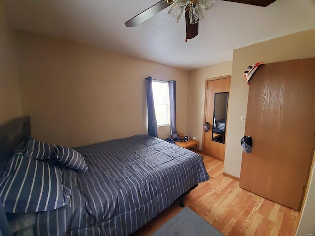 bedroom with ceiling fan and wood finished floors