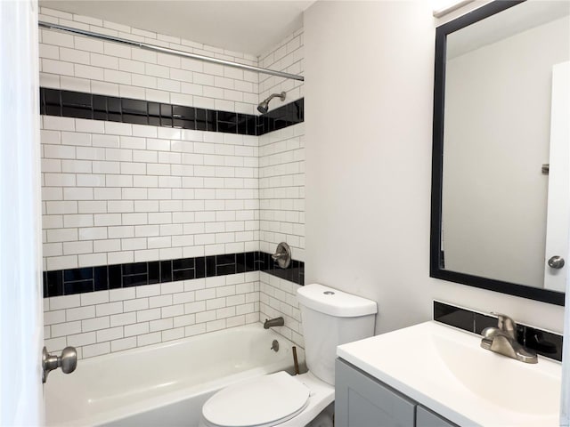 full bathroom featuring vanity, toilet, and tiled shower / bath