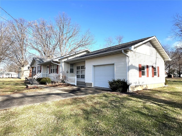 view of front of home with a front yard and a garage