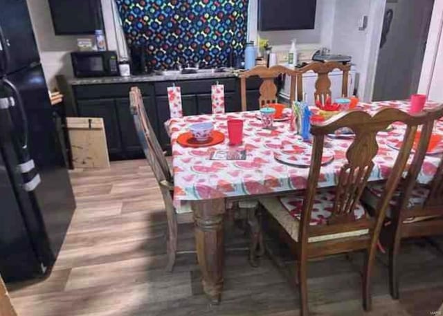 dining room with light hardwood / wood-style floors