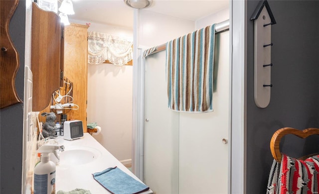 bathroom with sink and walk in shower