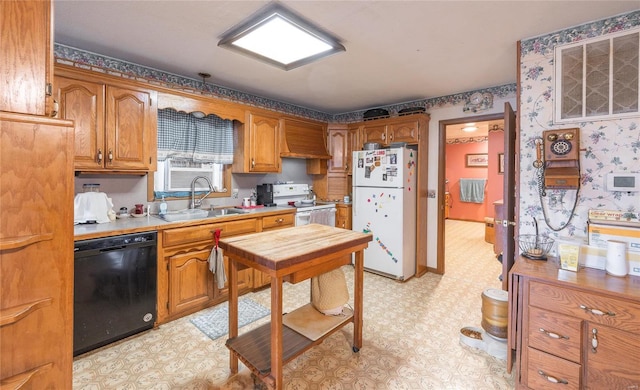 kitchen with white appliances and sink