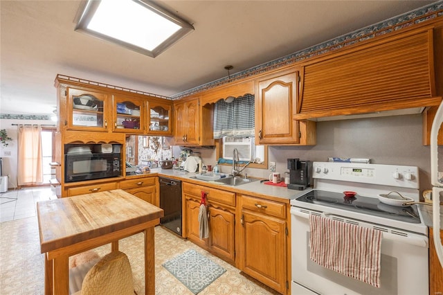 kitchen with light tile patterned floors, sink, and black appliances