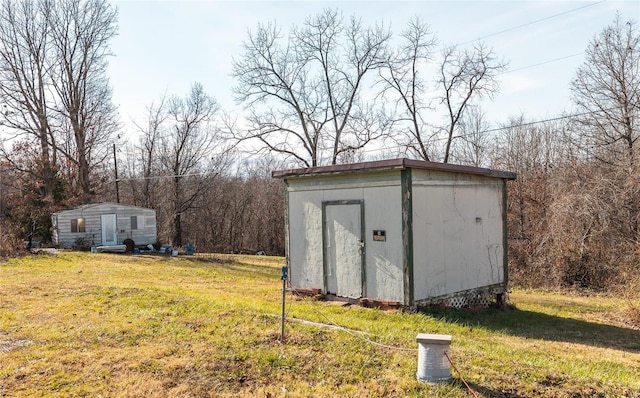 view of outdoor structure with a lawn