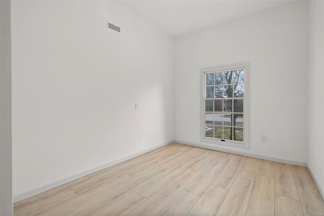 unfurnished room featuring light wood-type flooring