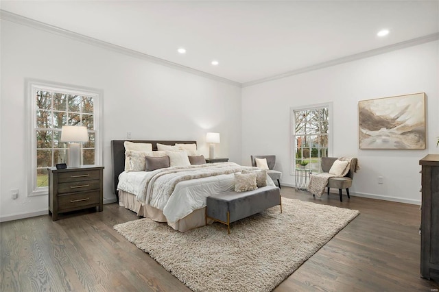 bedroom featuring dark hardwood / wood-style flooring, multiple windows, and ornamental molding