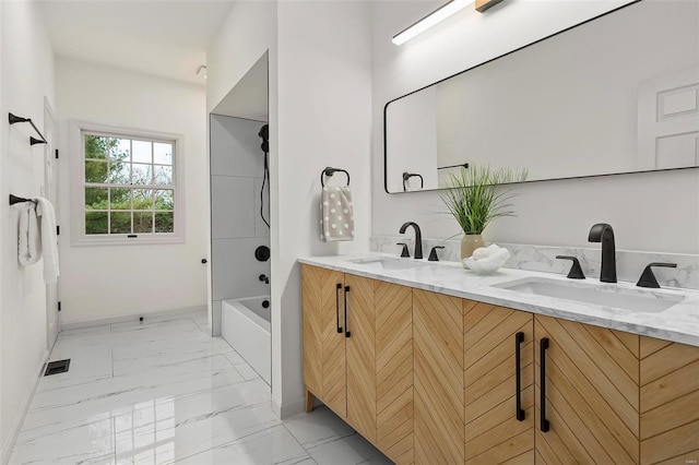 bathroom with bathing tub / shower combination and vanity