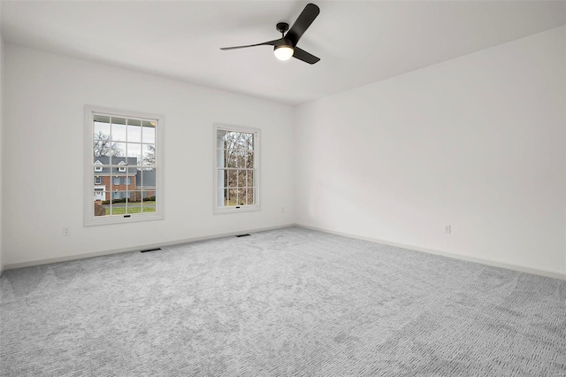 empty room with carpet and ceiling fan