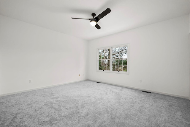 unfurnished room with carpet floors and ceiling fan