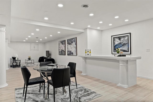 dining room with light hardwood / wood-style flooring