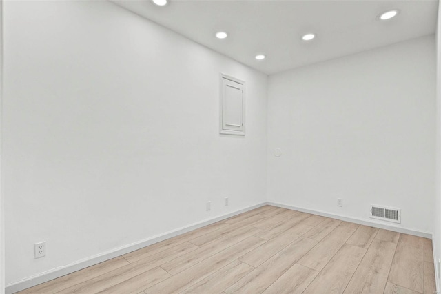 unfurnished room featuring light wood-type flooring