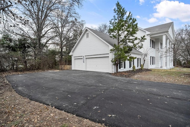 view of property exterior with a garage