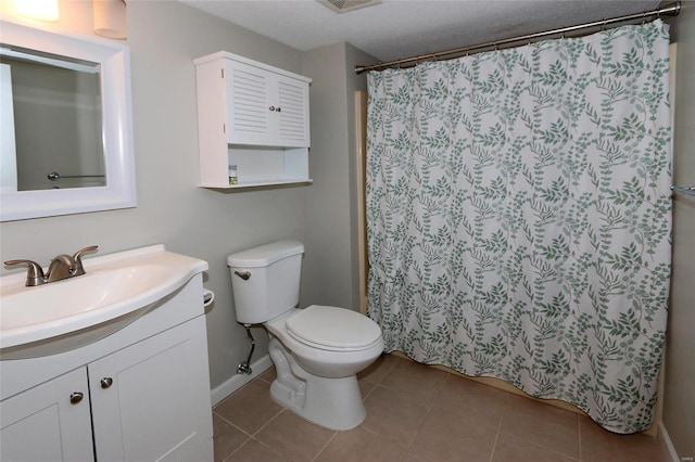 bathroom featuring tile patterned floors, a textured ceiling, toilet, vanity, and a shower with shower curtain