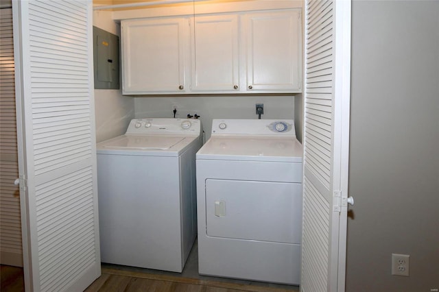 laundry area with electric panel, dark hardwood / wood-style flooring, cabinets, and independent washer and dryer