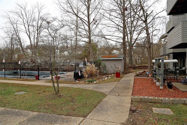 exterior space featuring a shed and a covered pool