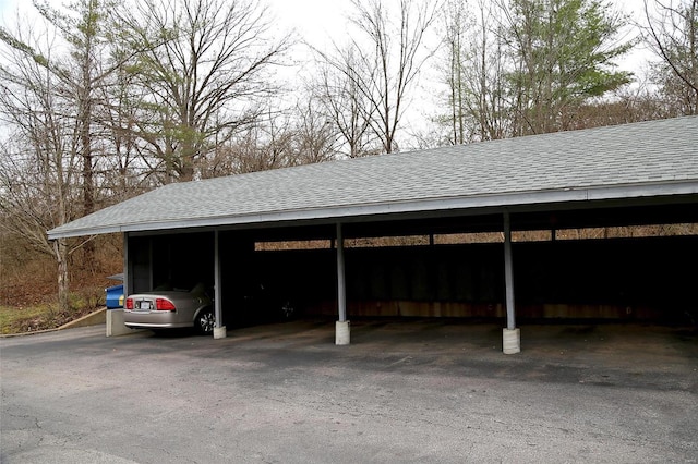 view of parking / parking lot featuring a carport