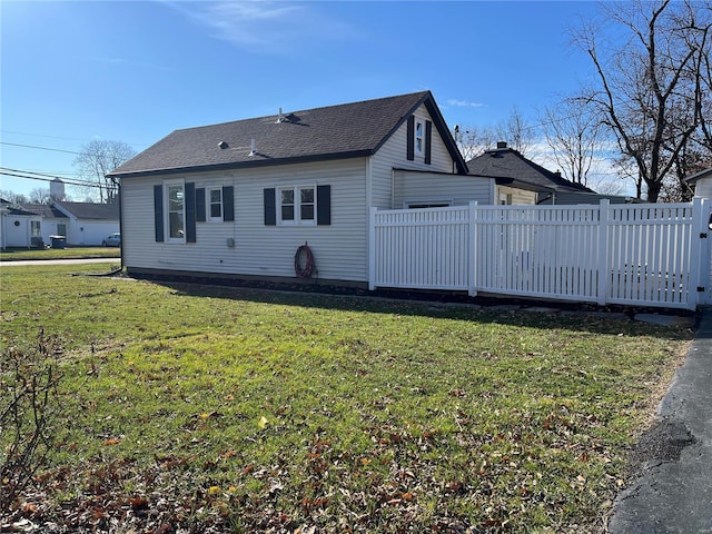 view of side of home featuring a yard