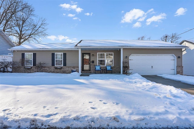 ranch-style house with a garage and covered porch