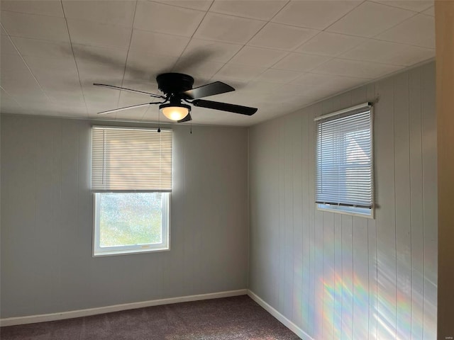 carpeted empty room with ceiling fan