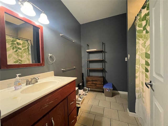 bathroom with tile patterned flooring and vanity