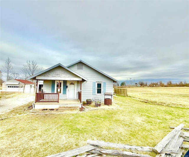 view of front of house with a porch and a front lawn