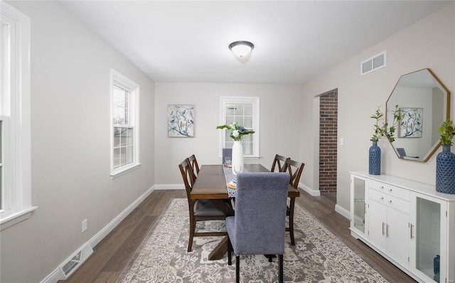 dining room with dark hardwood / wood-style floors