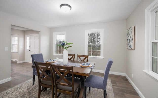 dining space featuring dark hardwood / wood-style flooring