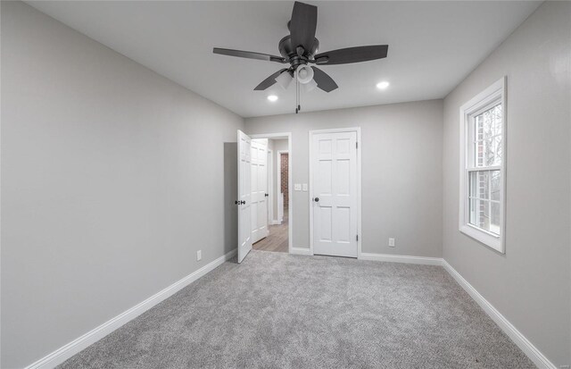 unfurnished bedroom with light carpet and ceiling fan