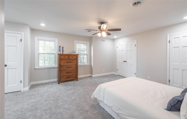 bedroom with ceiling fan and carpet