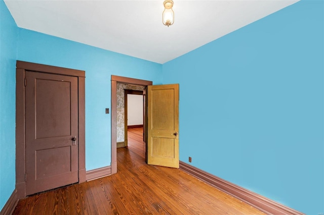 unfurnished bedroom with wood-type flooring