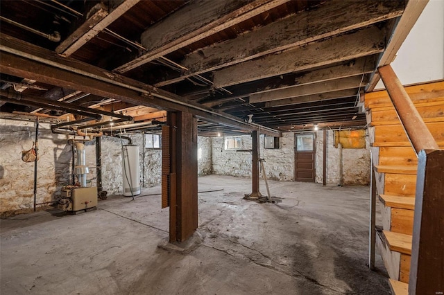 basement with gas water heater and electric panel