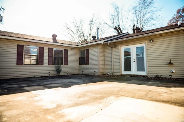 back of property featuring a patio