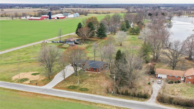 birds eye view of property featuring a rural view and a water view