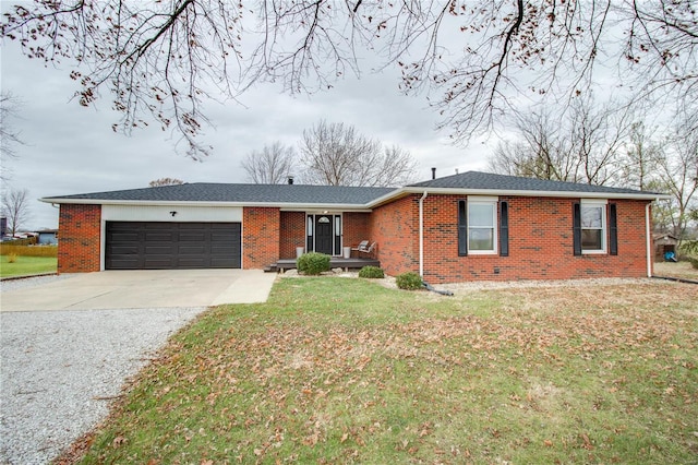 ranch-style house featuring a garage and a front lawn