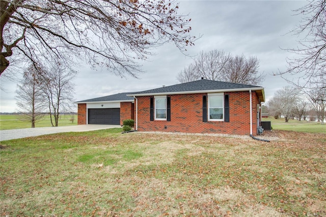 ranch-style house with a front yard and a garage