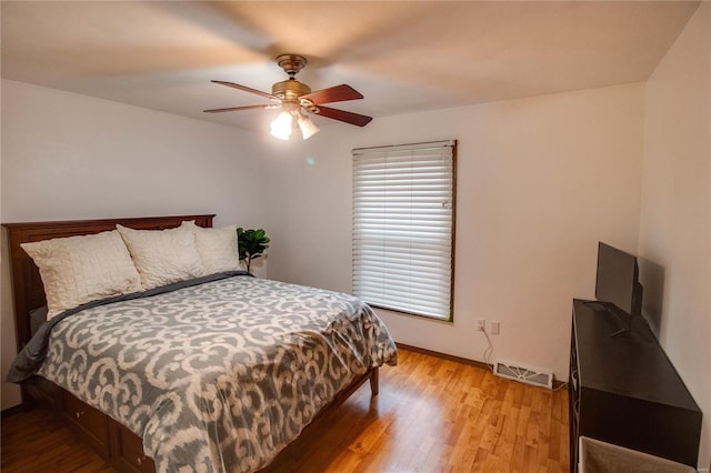 bedroom featuring ceiling fan and light hardwood / wood-style floors