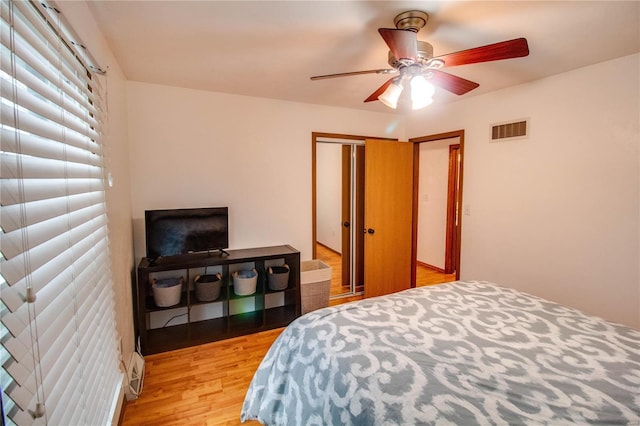 bedroom featuring ceiling fan and light hardwood / wood-style floors