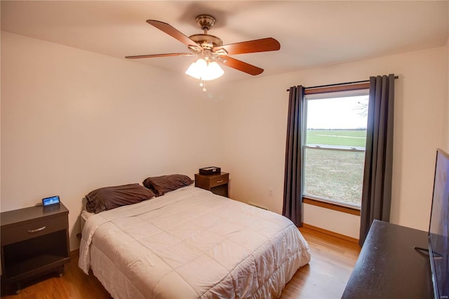 bedroom featuring ceiling fan and light wood-type flooring