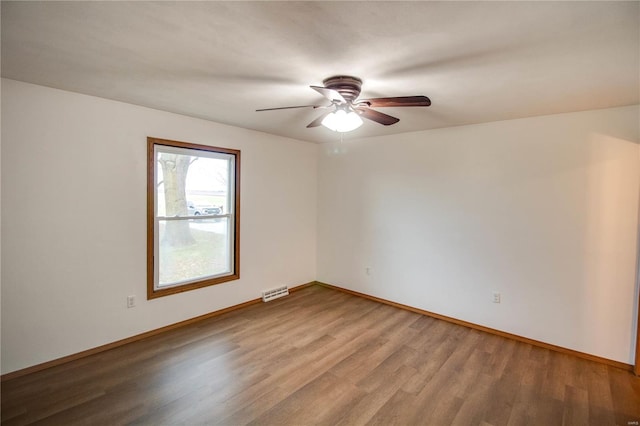 unfurnished room with wood-type flooring and ceiling fan