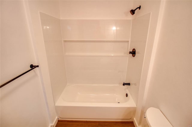 bathroom with toilet and shower / washtub combination