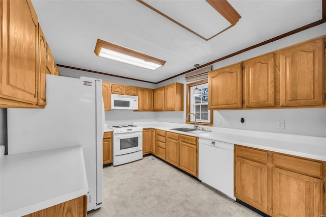 kitchen with sink, white appliances, and ornamental molding